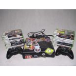 An Xbox 360 with power cable, two controllers and a selection of games