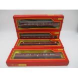 A collection of four boxed Tri-ang Hornby maroon railway coaches including the Sleeping Car,