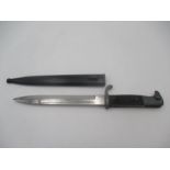 A German WWII bayonet, the steel blade stamped E u F Horster, Solingen, with eagle head handle,