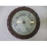 A Victorian aneroid barometer with rope twist frame