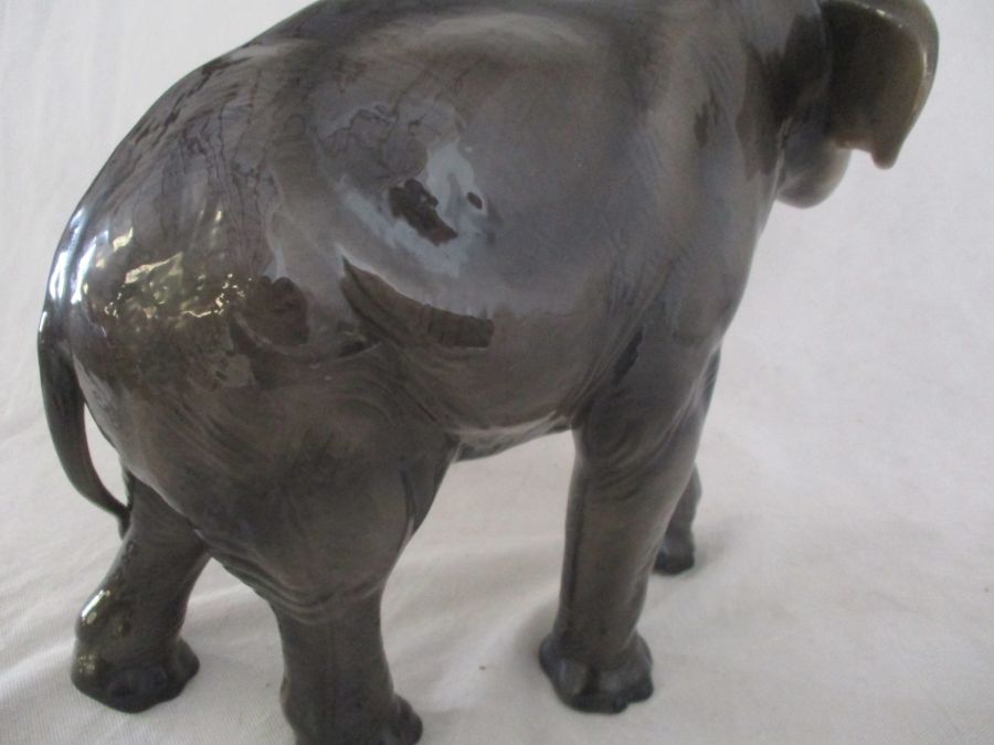 A ceramic elephant. Height 41cm. Has had a repair to one tusk. AF - Image 8 of 15