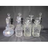 A collection of eight glass decanters