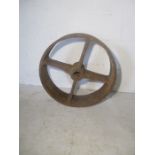 A vintage cast Iron wheel, see photos for measurements