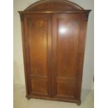A dome topped mahogany cupboard with four shelves
