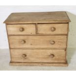 A small pine chest of four drawers - height 70cm, width 85cm, depth 42cm
