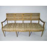 A gilt Regency style upholstered sofa- 1 leg loose but present