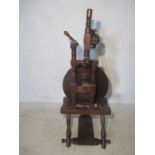 An antique spinning wheel.