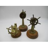 A brass miniature engine room telegraph on wooden base (height 18cm), along with a compass in the