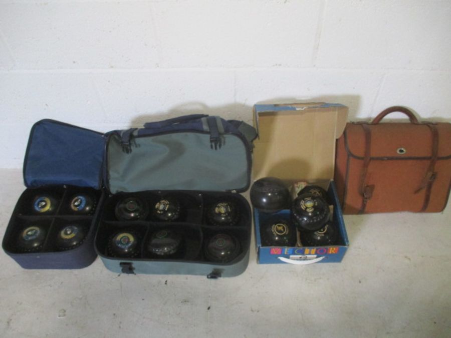 A collection of lawn bowls, including Thomas Taylor, Almark, Taylor Vector. Some are marked