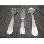 A set of metal wall hangings in the form of a oversized fork, knife and spoon - approx. 61cm in