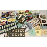 A large collection of cigarette cards, tea cards and trade cards including Wills, Players,