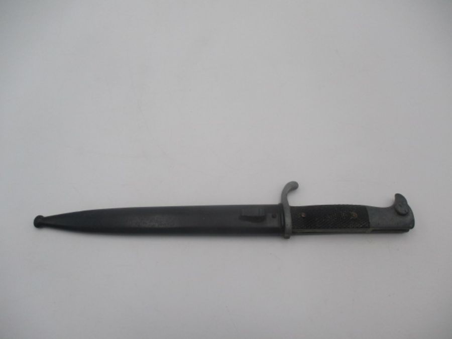 A German WWII bayonet, the steel blade stamped E u F Horster, Solingen, with eagle head handle, - Image 6 of 7