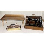 A Singer 99k sewing machine along with a vintage lap tray "The Superior", a 60's tiled warming
