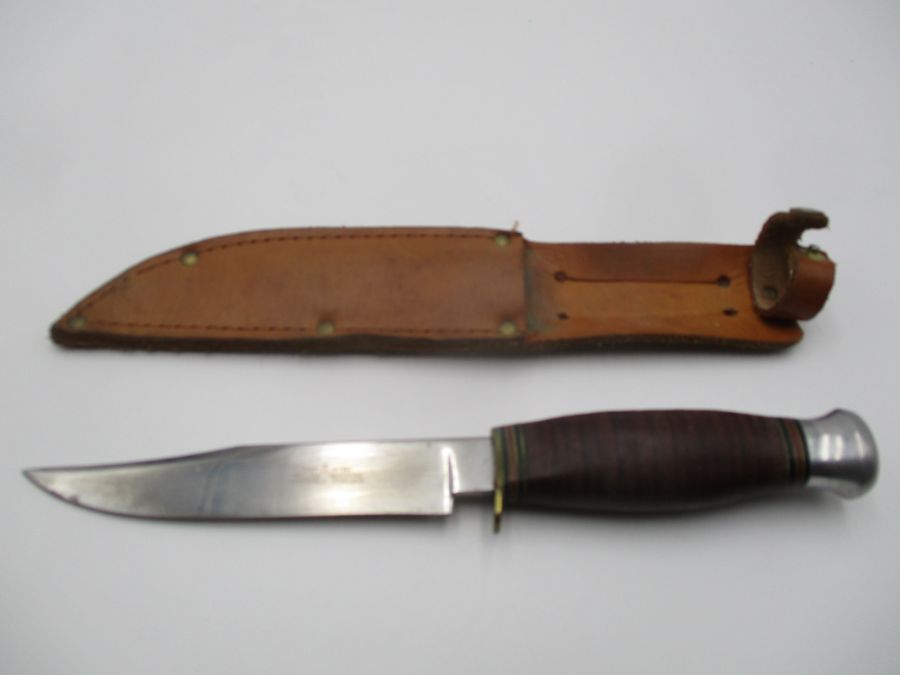 A William Rodgers "I Cut My Way" vintage knife in leather sheath