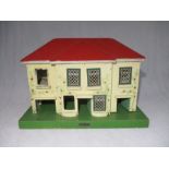 A vintage Amersham Toys dolls house