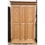 A pine two door wardrobe - height 200cm, width 123cm, depth 55cm