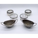 A pair of hallmarked boat shaped silver salts, four silver rimmed salts (1 A/F)and two silver salt