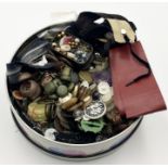 A tin of vintage buttons and various haberdashery