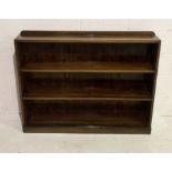 A dark wood bookcase with three shelves