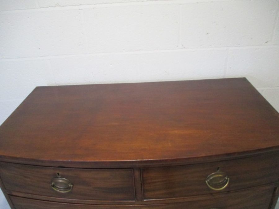A Georgian mahogany bow fronted chest of drawers. - Image 3 of 10