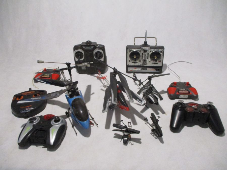 A collection of five remote control helicopters