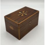 A Georgian inlaid tea caddy