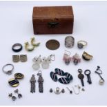 A small quantity of silver and costume jewellery in a leather Harrods casket style box