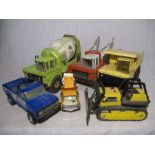 A collection of vintage Tonka vehicles including a Ready mixer, 24 hour recovery truck, dumper truck