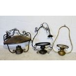Three brass hanging lamps with glass shades and chimneys