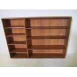 A large freestanding shelving unit - height 132cm, width 183cm, depth 28cm