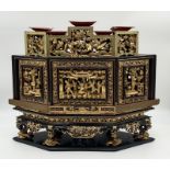 A 19th century Chinese three-tiered six sided ornate gilded and lacquered wooden offering box (