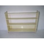 A large white painted freestanding bookcase - height 117cm, width 155cm, depth 27cm