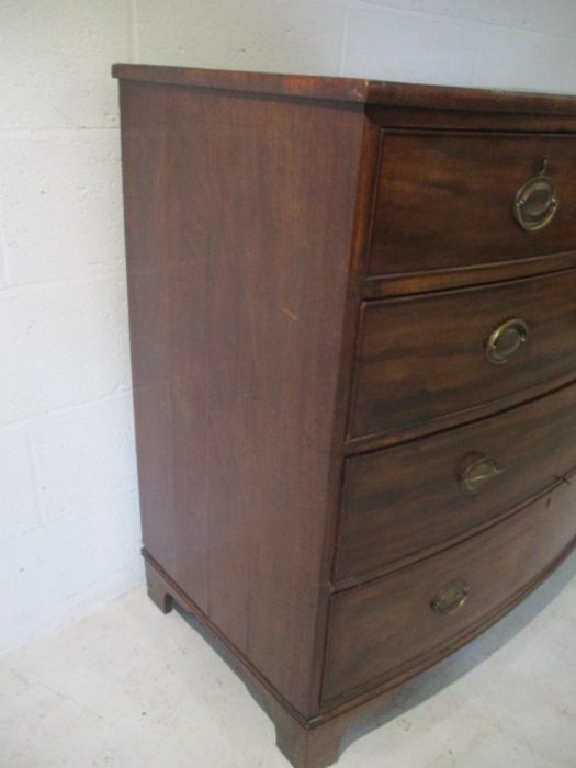 A Georgian mahogany bow fronted chest of drawers. - Image 4 of 10