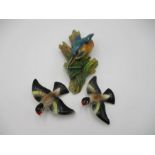 A Bosson's Kingfisher wall hanging plaque, along with two other ceramic birds
