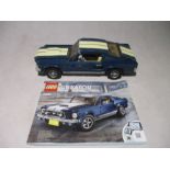 A completed Lego Creator (10265) Ford Mustang with instruction booklet