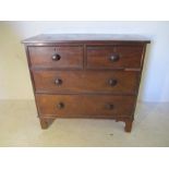 A Victorian mahogany chest of four drawers - back legs A/F