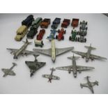 A collection of vintage die cast vehicles including racing cars, a locomotive, land rover, planes,