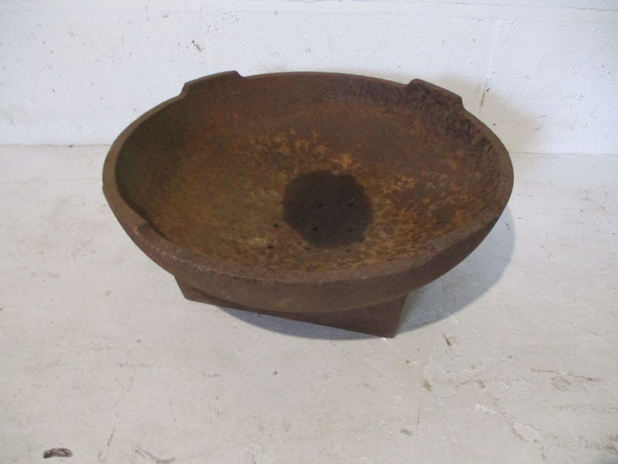 A cast iron trough - diameter 44.5cm height 18cm