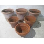 A small collection of terracotta flowerpots