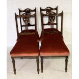 A set of four Art Nouveau upholstered dining chairs on turned legs