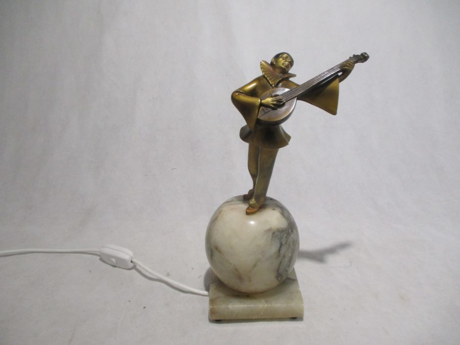 A vintage Pierrot lamp on alabaster sphere