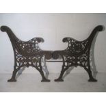 A pair of cast iron bench ends.