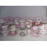 A collection of turn of the century pink themed china including Commemorative ware etc.