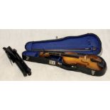 A "Lark" cased violin with bow and music stand