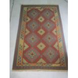 A 20th Century Kelim rug with geometric pattern, 216cm x 143cm