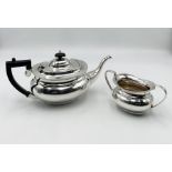 A hallmarked silver tea pot with matching sugar bowl ( Sheffield 1994) total weight 957.2g
