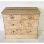 A pine chest of four drawers