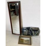 A wooden framed mirror with metal corners along with one other and framed picture of two pheasants