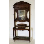 An oak hallstand with carved decoration