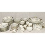 A comprehensive Limoges part dinner service comprising of dinner plates, side plates, tea cups,